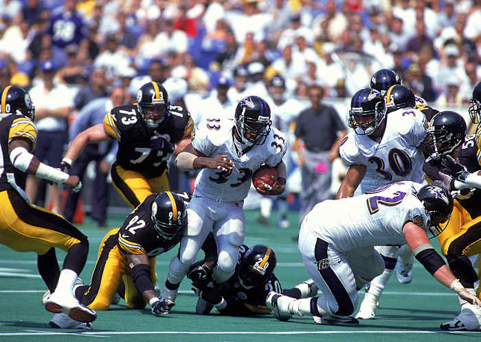Priest Holmes hits the hole in Pittsburgh in 2000.